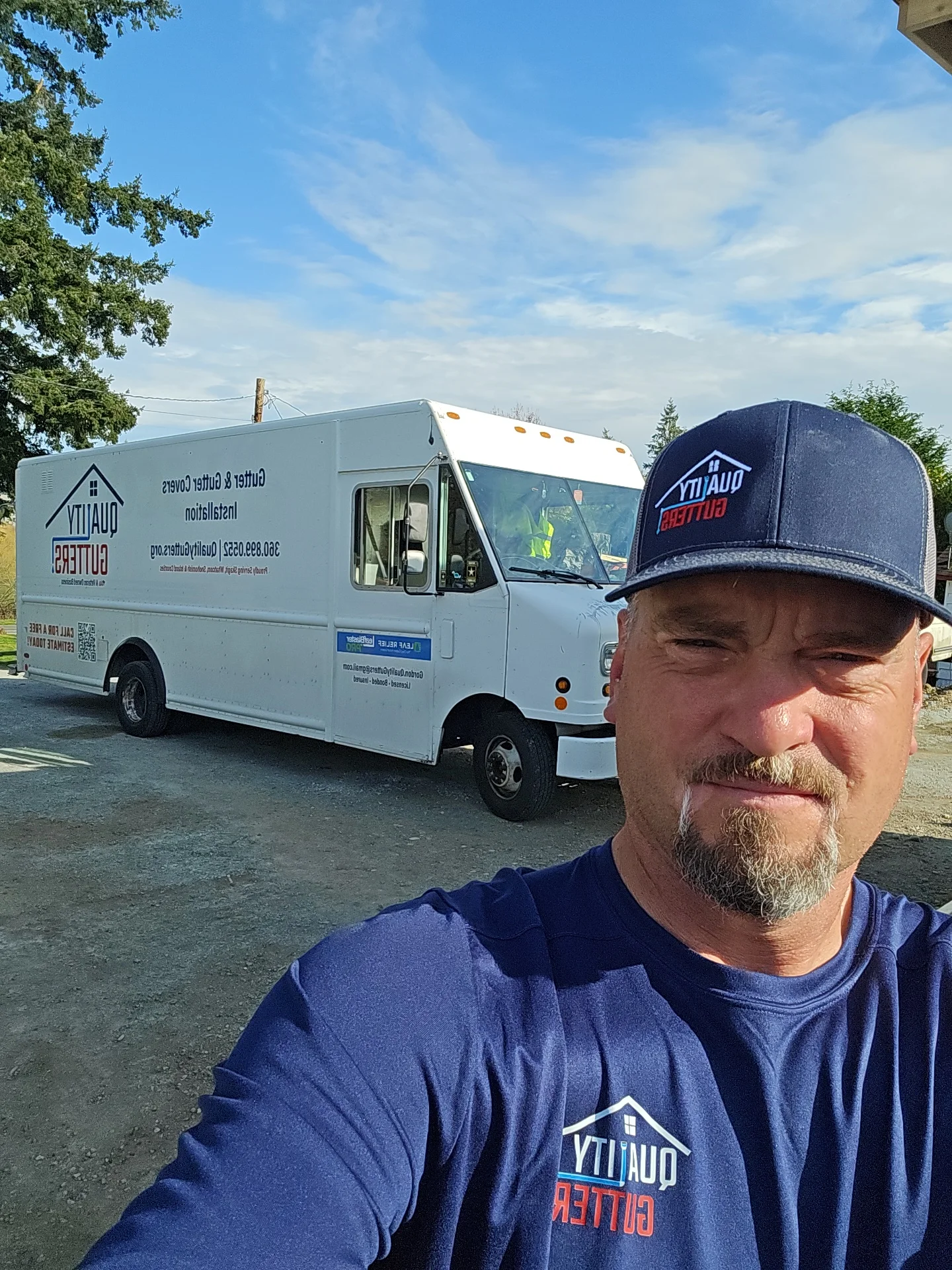 White service truck with custom vinyl wrap branding and company logo